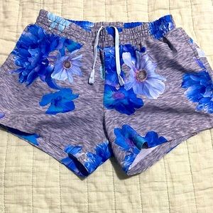 Old navy grey shorts with blue floral print.
